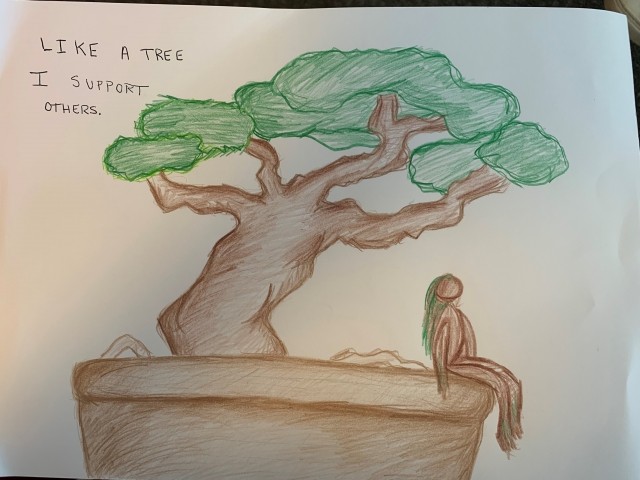 A sketch of a tree with a woman sitting underneath